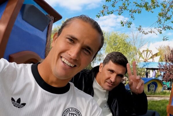 Alexander Zverev and Mischa Zverev sitting in the back of a car during the filming of adidas' Ride Home With series, laughing together while driving through Madrid.